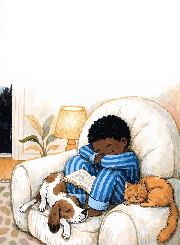 A boy in striped blue pyjamas curled up asleep in a big armchair with a picture book, a beagle across his legs and a ginger cat beside him